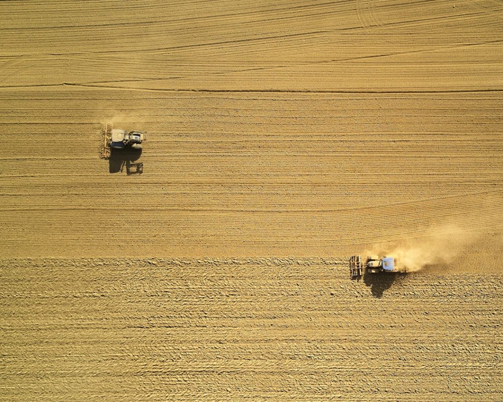 I had this shot in mind already long before I took it. And as it often happens, I wasn’t planning on being able to take it on that day, but then I saw both tractors on their field from 1km away, and so I started up the drone. Although I had to work against strong winds, I was able to capture what I had imagined before.

Buy awesome, limited edtition, photo prints: handpictphoto.com